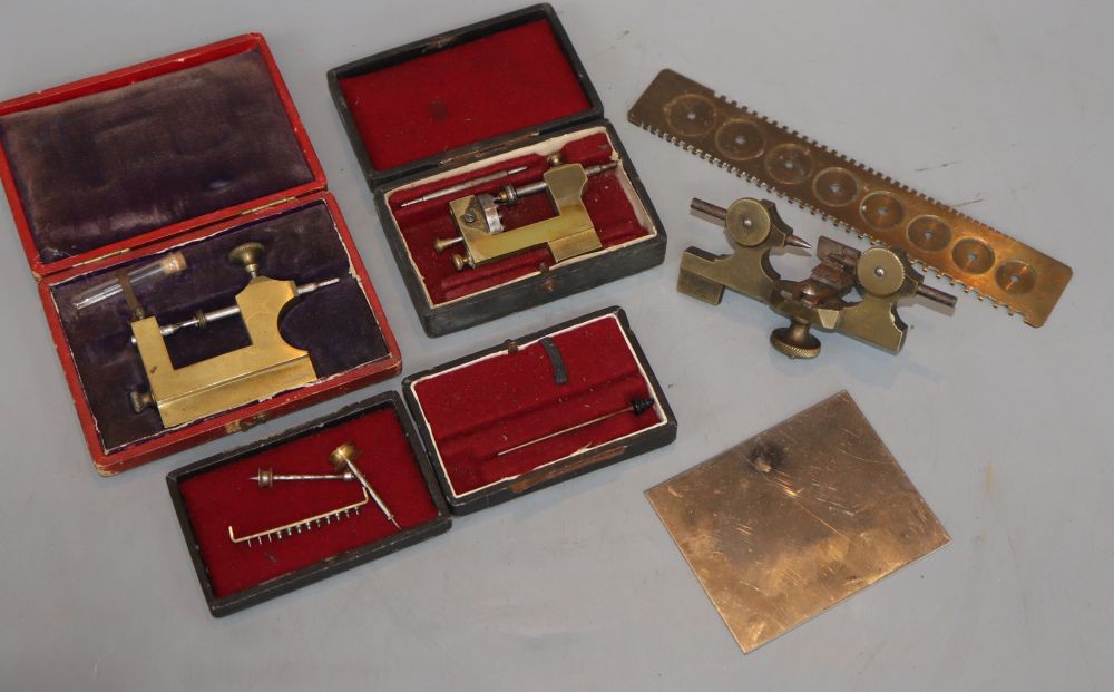 Various cased watchmakers tools